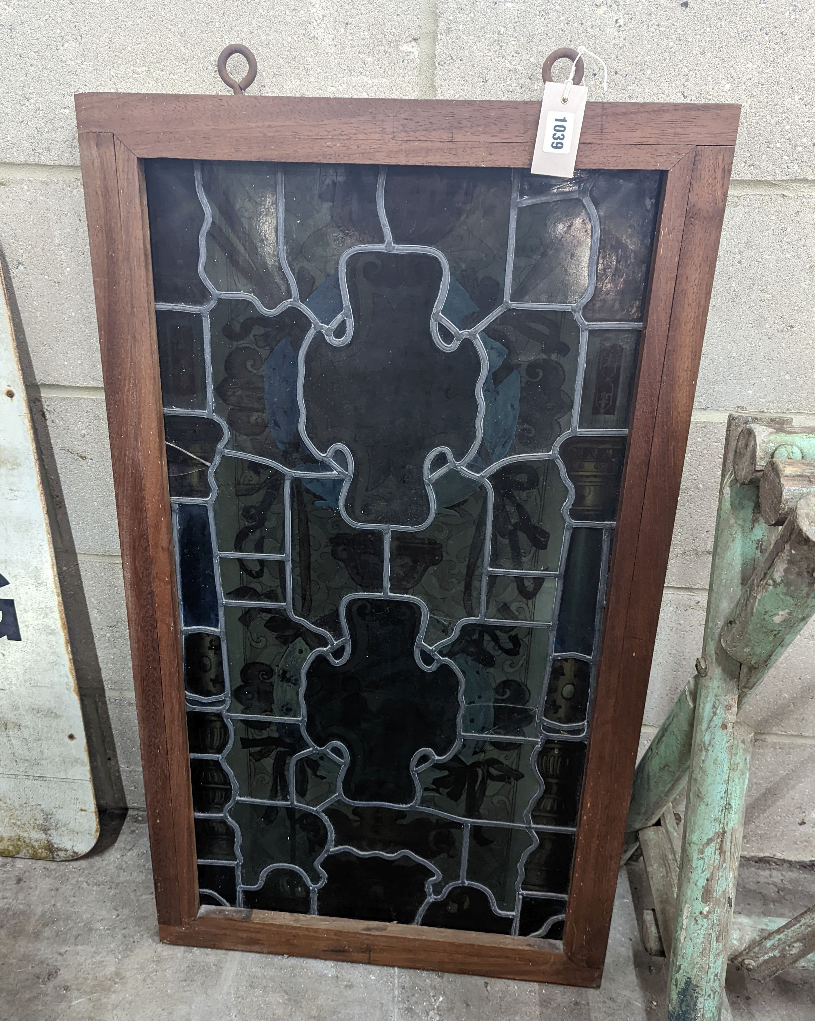 A rectangular stained glass panel, width 56cm, height 99cm including frame